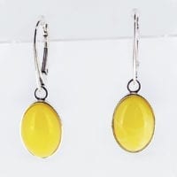 Simple Oval Butterscotch Amber Set In Sterling Silver Dangling Earrings